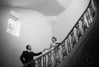bride and groom in staircase