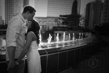 engagement kiss in the fountain